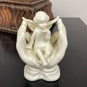 Home Decor. Ceramic Angel in hands.